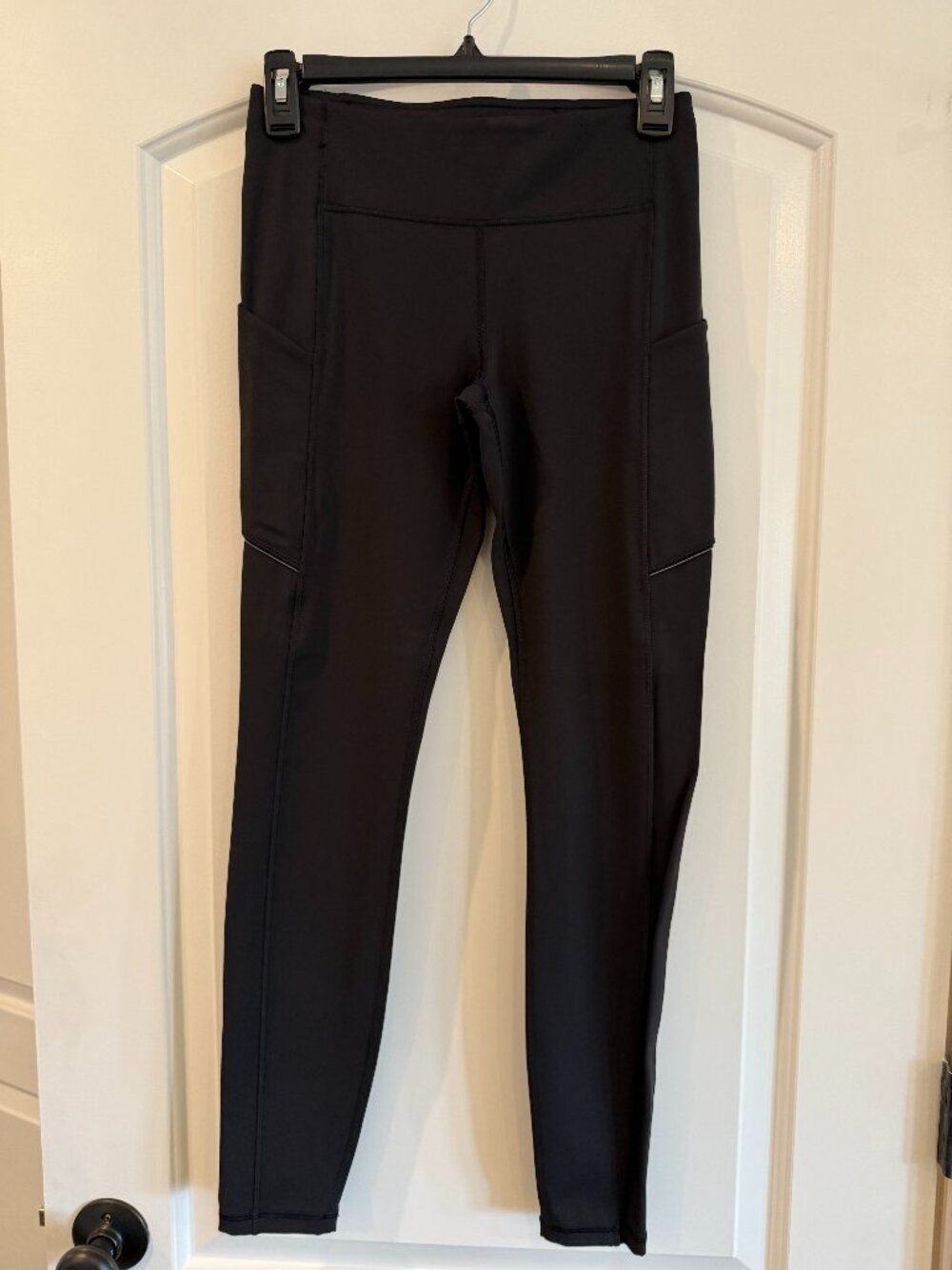 NEW Lululemon Black Speed Up Tights featuring side pockets.
